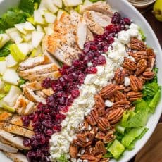 Autumn Chopped Chicken Salad will be your favorite Fall salad. Chicken Salad with pears, craisins, pecans, feta and chicken with easy balsamic vinaigrette! | natashaskitchen.com