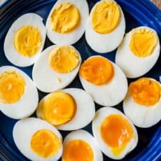 boiled eggs on a platter with hard boiled eggs, medium boiled eggs and soft boiled eggs