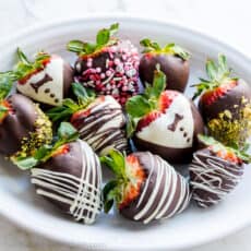 chocolate covered strawberries on white platter