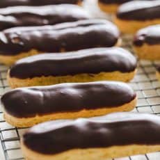 You haven't enjoyed an Eclair until you've tried a fresh homemade eclair! Learn how to make Eclairs with choux pastry, pastry cream and chocolate ganache. | natashaskitchen.com