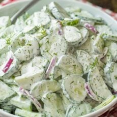 creamy cucumber salad recipe with crispy cucumbers, tangy red onions and delicious sour cream dressing