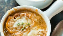 French Onion soup served in bowls with toasted breads