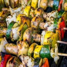 A close up of Moroccan vegetable skewers on a grill