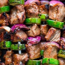 These grilled steak kebabs are juicy and mouthwatering-delicious! It marinates overnight which makes the steak kebabs tender and so flavorful. | natashaskitchen.com