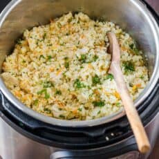 Instant Pot Chicken and Rice inside instant pot with spoon