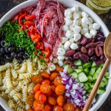 Italian pasta salad in serving bowl with Italian dressing