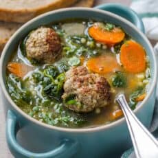 Italian Wedding Soup in a bowl with a spoon