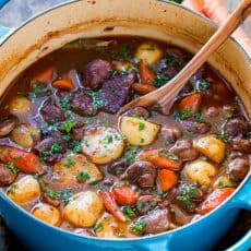 Classic lamb stew is loaded with hearty, healthy ingredients. This lamb stew recipe is simple (a one-pot meal!) and perfect for special occasions (think Easter!). Baking the stew in the oven makes the tender lamb morsels and root vegetables just melt in your mouth. Learn how to make traditional lamb stew. | natashaskitchen.com