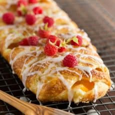 You'll make this braided danish again and again. It has a cheesecake center and is loaded with peaches. This braided danish is easier than you think! How To make braided danish | natashaskitchen.com