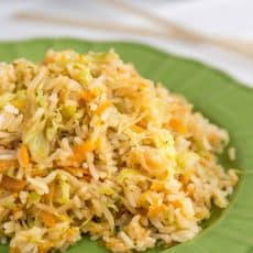 A green plate of cabbage fried rice