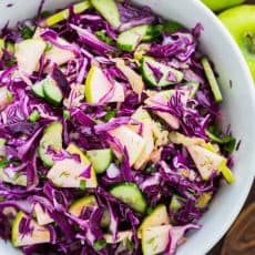 My Sister Alla's Red Cabbage Salad with Apple is loaded with the best Autumn Ingredients. She sneaks sauerkraut into her salad, making it like a red cabbage slaw. One of our Favorite Red Cabbage Recipes! | natashaskitchen.com