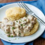 homemade Biscuits and Gravy recipe served on a white plate