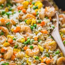 Shrimp fried rice in skillet with spatula