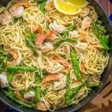 Shrimp Scampi Pasta with Asparagus has a lemon garlic and herb sauce that packs so much fresh and amazing flavor. A 30 minute shrimp scampi pasta recipe! | natashaskitchen.com