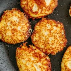 Draniki (aka deruny), are Russian stuffed potato pancakes made with grated potatoes. These are stuffed with a juicy meat patty - a delicious surprise! | natashaskitchen.com