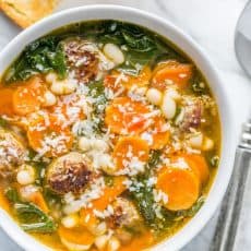 This White Bean, Sausage and Kale soup is wholesome comfort food. The sausages make fuss-free meatballs and infuse the soup with great flavor | natashaskitchen.com