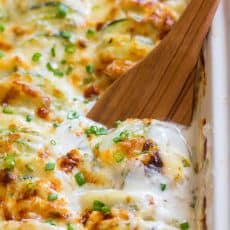 Creamy, cheesy Zucchini Potato Bake in a garlic Alfredo sauce. This potato bake recipe has simple ingredients, comes together quickly and tastes so good! | natashaskitchen.com